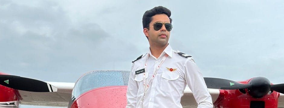 Male student pilot posing in front an aircraft